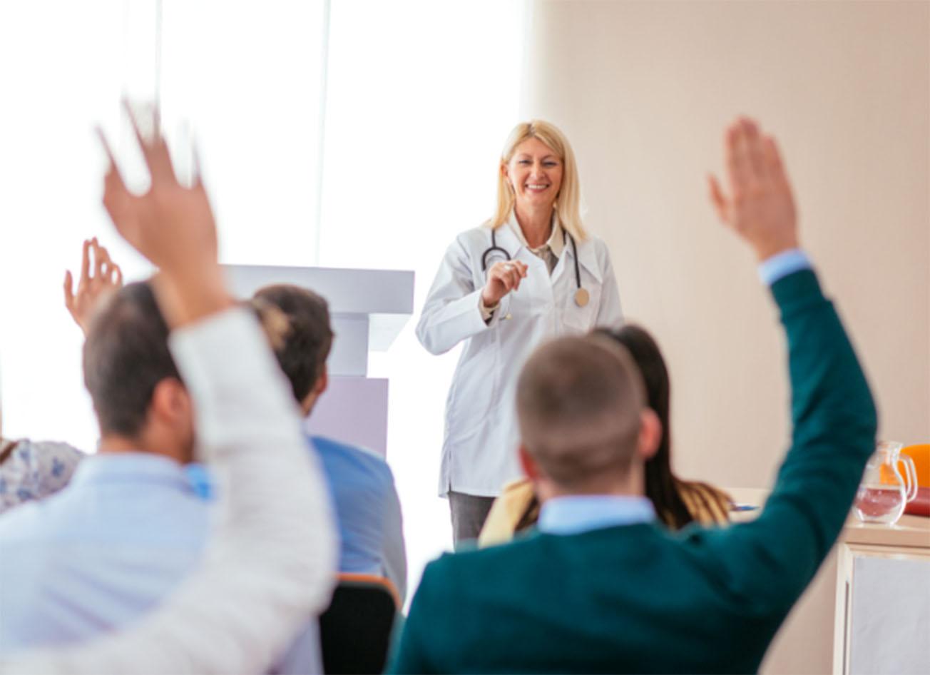Physicians engaging in a classroom